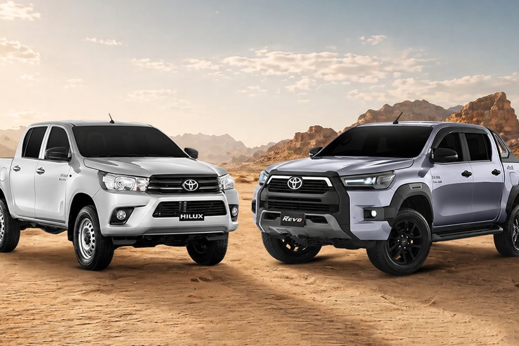 Toyota Hilux and Hilux Revo, two of the best armoured pickup trucks in Pakistan, parked on a desert terrain with rocky mountains in the background.