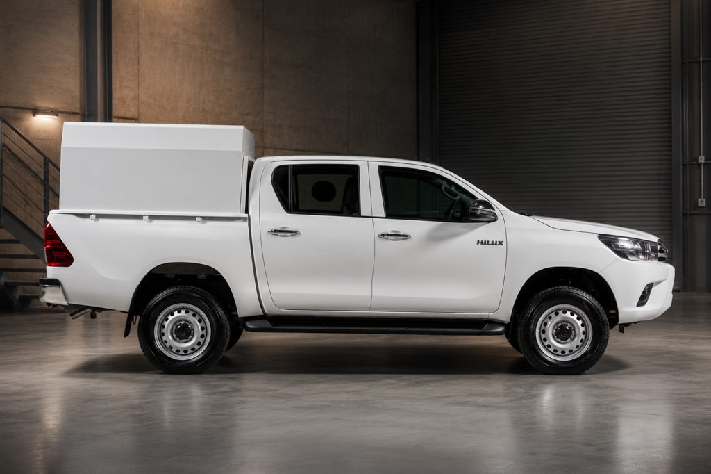 Bulletproof Hilux double cabin armoured pickup truck parked in a warehouse facility